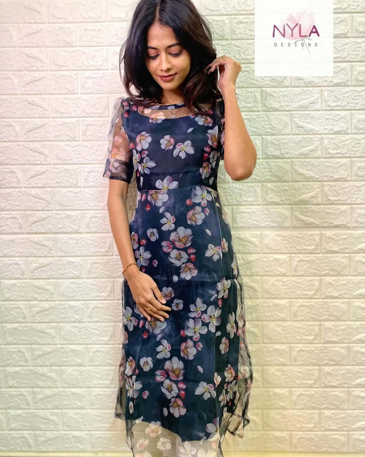 Embrace sheer elegance in this Organza A line kurti with elbow sleeves, where style meets sophistication effortlessly