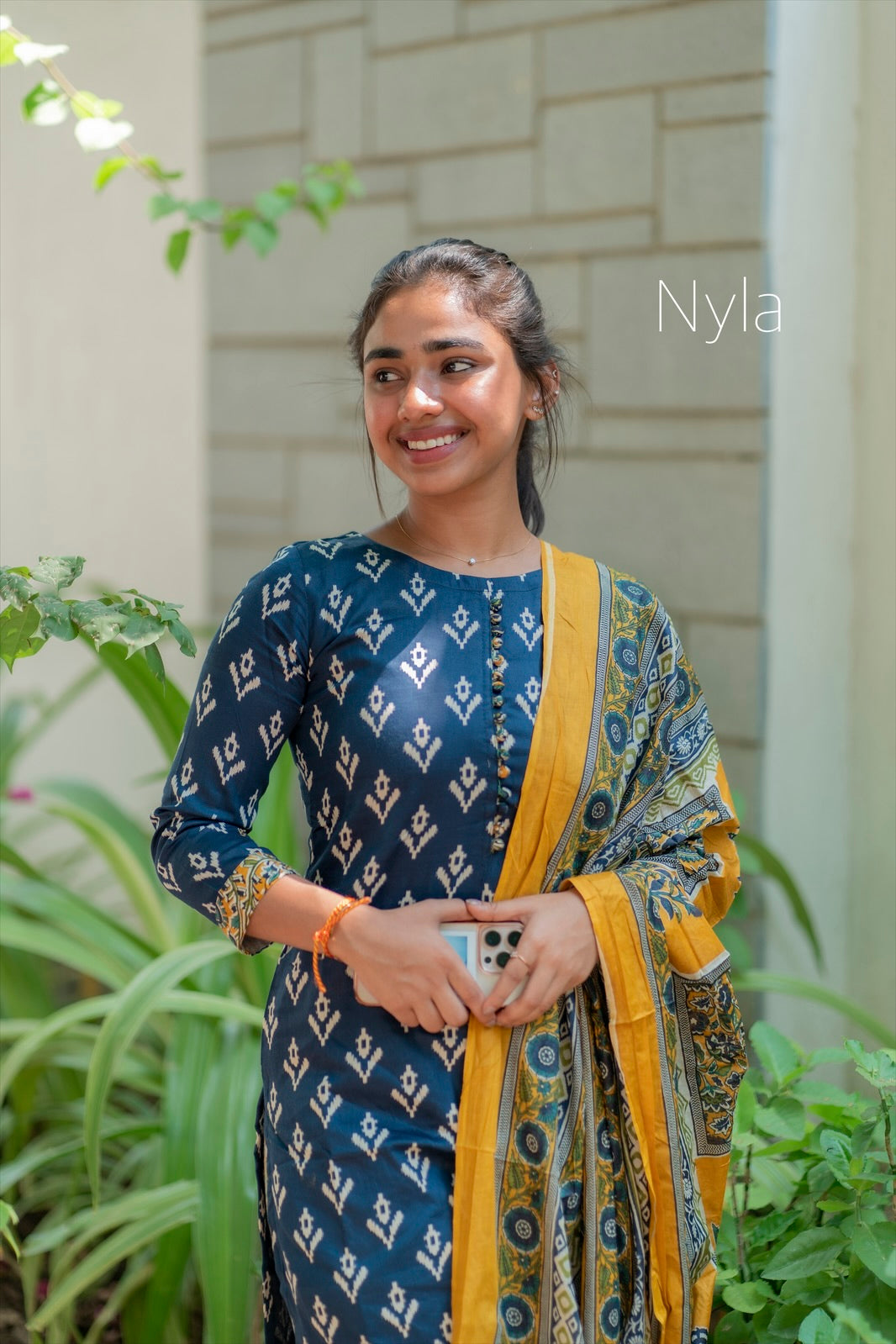 Elegant Silk cotton ikkat print kurti with potli button on yoke and kalamkari bottom and 3/4th sleeves