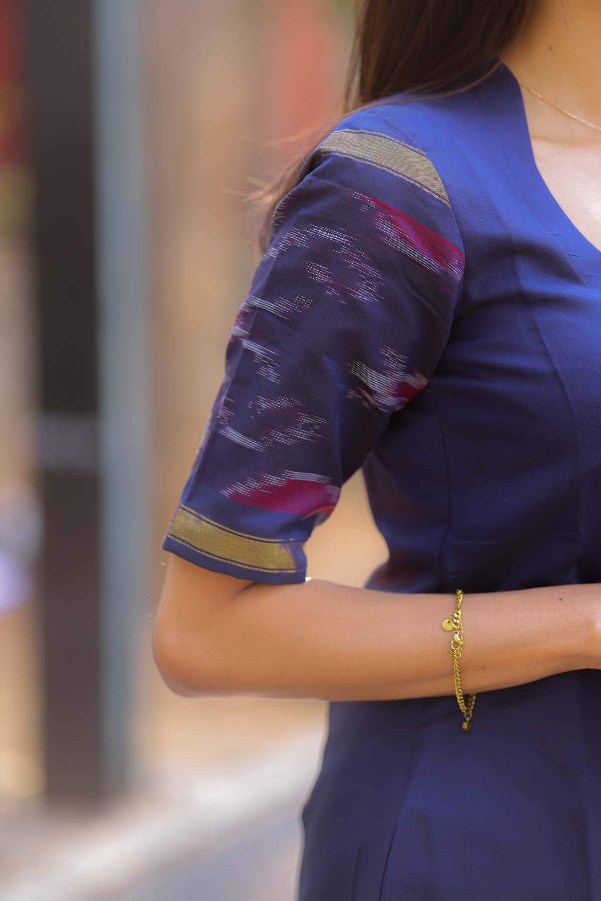 Elegant Ikkat Cotton kurti with pot neck elbow sleeves and potli buttons on the yoke
