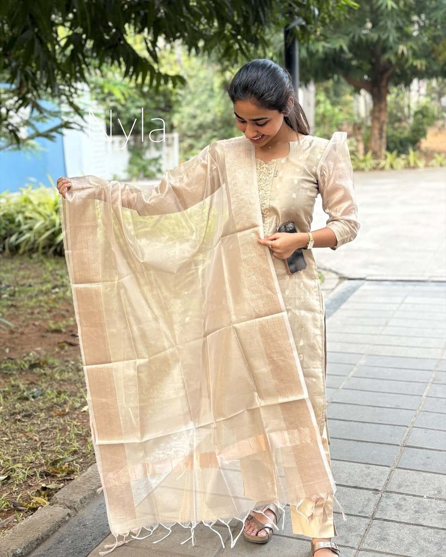 Elegant Tissue Shimmer  kurti with embroidery on neck line with 3/4th  puff sleeves