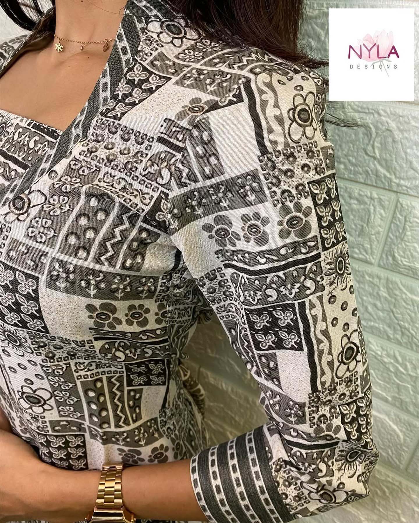 Embrace grace and style with the touch of Soft Rayon kurti set with foil prints and 3/4th sleeves