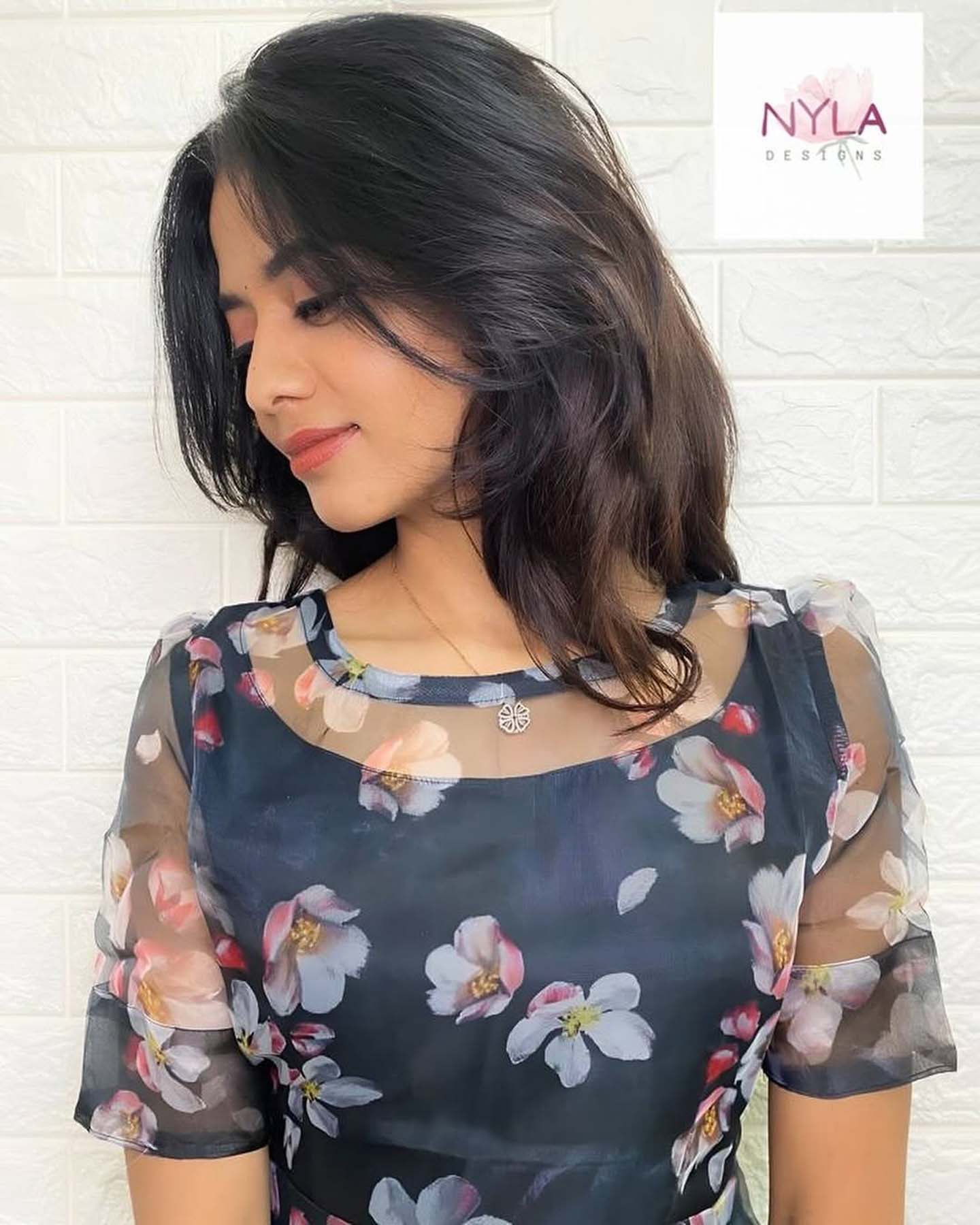 Embrace sheer elegance in this Organza A line kurti with elbow sleeves, where style meets sophistication effortlessly