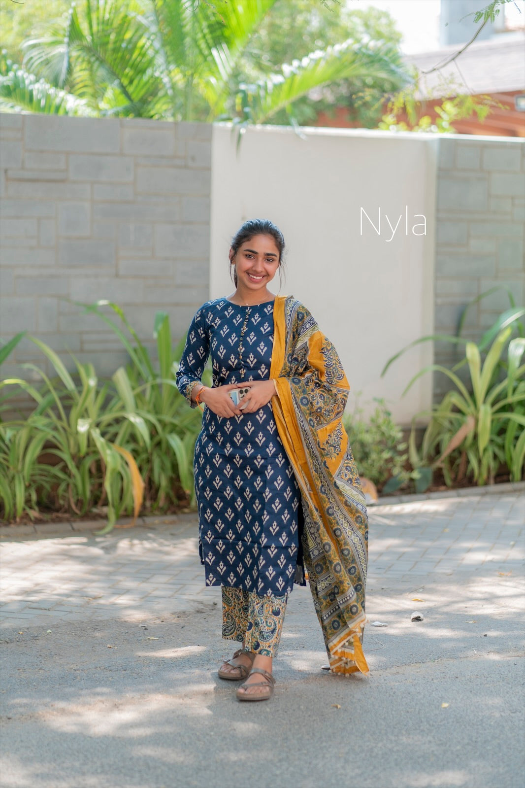 Elegant Silk cotton ikkat print kurti with potli button on yoke and kalamkari bottom and 3/4th sleeves