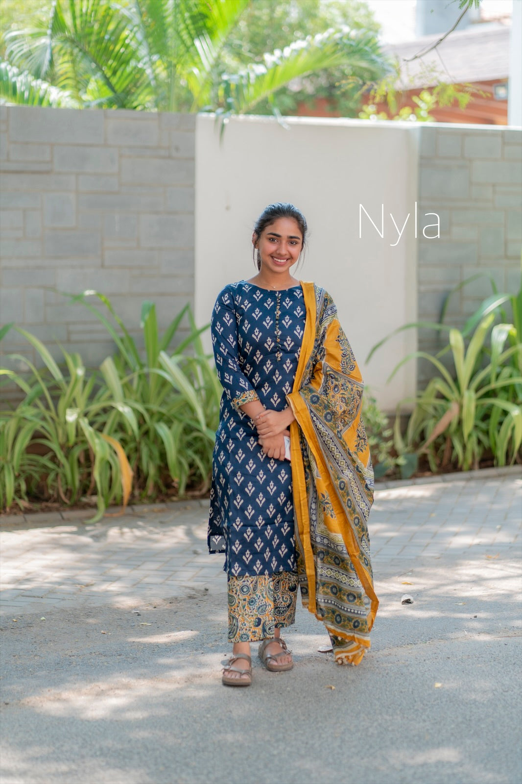 Elegant Silk cotton ikkat print kurti with potli button on yoke and kalamkari bottom and 3/4th sleeves